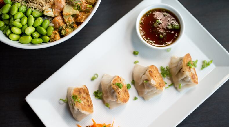 CO Pork and Ginger Gyoza dumplings with soy scallion sauce. Photo credit- Mia Yakel.