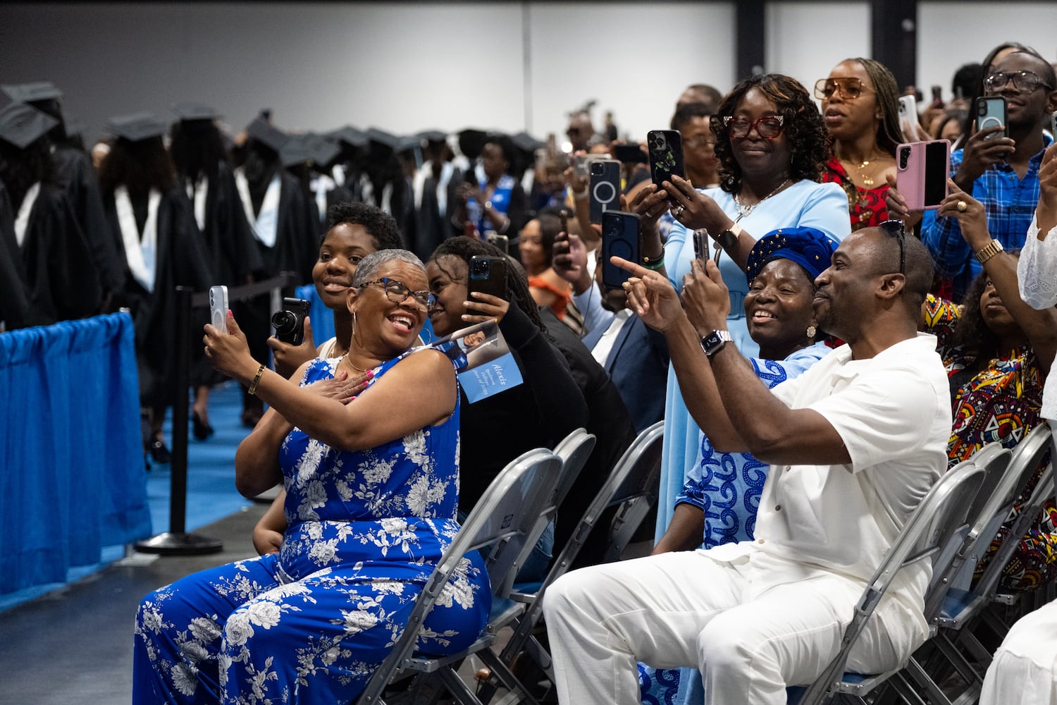 People look for their graduates during the procession at the Spelman College graduation ceremony at the Georgia International Convention Center in College Park on Sunday, May 18, 2025.   Ben Gray for the Atlanta Journal-Constitution
