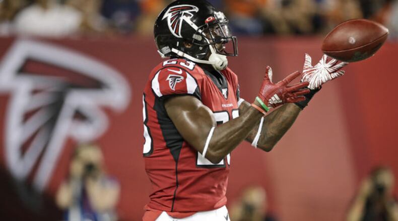 Falcons running back Brian Hill catches a 1-yard touchdown pass during the first half of the team's Pro Football Hall of Fame NFL preseason game against the Denver Broncos, Thursday, Aug. 1, 2019, in Canton, Ohio. (AP Photo/Ron Schwane)