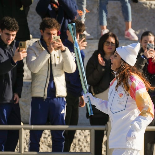 Italian former foil fencer and Olympic and world champion Elisa Di Francisca carries the 2026 Milan Cortina Winter Olympics torch in Rome as it begins its journey through Italy, Saturday, Dec. 6, 2025, a journey that will conclude in Milan in February 2026. (AP Photo/Andrew Medichini)