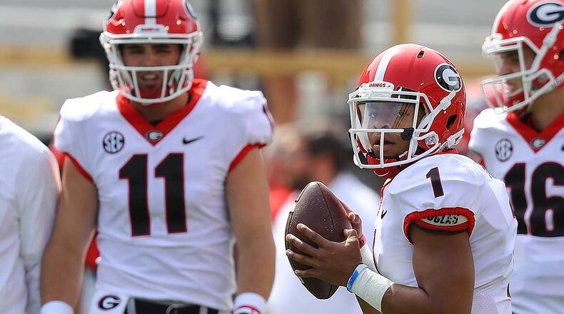 Quarterbacks Jake Fromm (11) and Justin Fields (1) prepare for Saturday's G-Day game at Sanford Stadium in Athens. (Curtis Compton/ccompton@ajc.com)