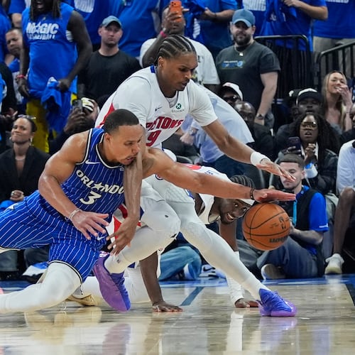 Orlando Magic guard Desmond Bane (3) goes after a loose ball against Detroit Pistons guard Ausar Thompson during the second half in Game 4 of a first-round NBA basketball playoff series, Monday, April 27, 2026, in Orlando, Fla. (AP Photo/John Raoux)