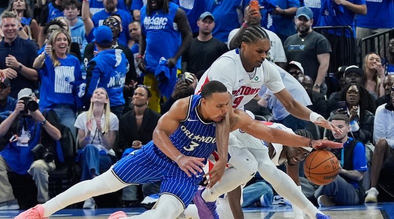 Orlando Magic guard Desmond Bane (3) goes after a loose ball against Detroit Pistons guard Ausar Thompson during the second half in Game 4 of a first-round NBA basketball playoff series, Monday, April 27, 2026, in Orlando, Fla. (AP Photo/John Raoux)