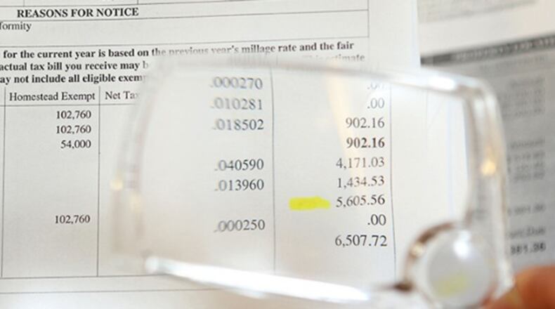 Many DeKalb homeowners will pay higher taxes this year because of higher property assessments. (JASON GETZ / JGETZ@AJC.COM)