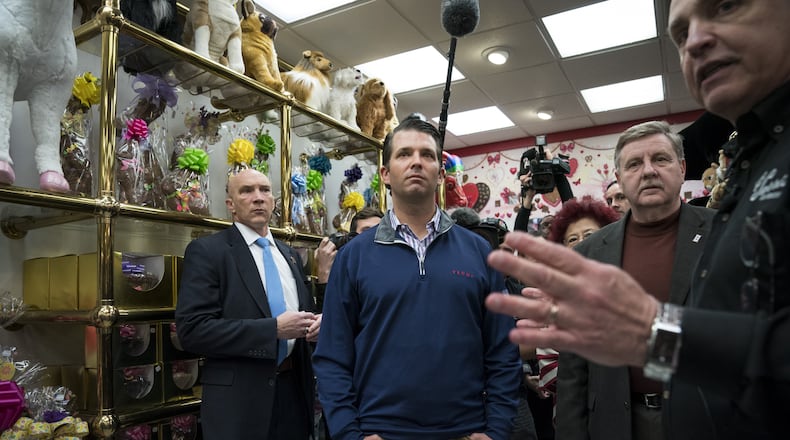 Donald Trump Jr. and Rick Saccone, Republican congressional candidate for Pennsylvania's 18th District, take a tour of Sarris Candies in Cannonsburg, Pa., on Monday. Saccone is running in a tight race for the vacated seat of congressman Tim Murphy against Democratic candidate Conor Lamb. Drew Angerer/Getty Images