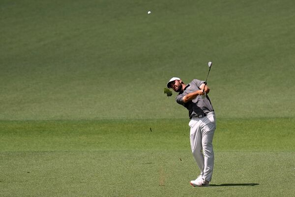Scottie Scheffler hits from the fairway on the second hole during the third round at the Masters golf tournament, Saturday, April 12, 2025, in Augusta, Ga. (AP Photo/David J. Phillip)