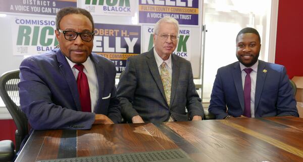 Rick Blalock, attorney David Betts and Robert Kelly after a Friday press conference
