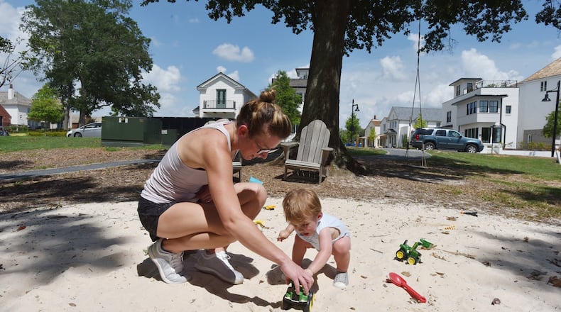 Spenser Hewett plays with her 15-month-old son Eliot in Pinewood Forest community in Fayetteville on Saturday, June 22, 2019. Spenser and Cory Hewett are millennials who have left their life in Buckhead for Fayette County, metro Atlanta’s oldest county by age. HYOSUB SHIN / HSHIN@AJC.COM