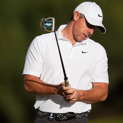 Rory McIlroy. of Northern Ireland, reacts after putting on the the 11th hole during the first round of the Australian Open golf tournament in Melbourne, Australia, Thursday, Dec. 4, 2025. (AP Photo/Asanka Brendon Ratnayake)