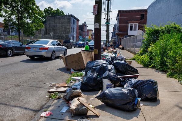 Trash sits on sidewalk along Cumberland and Fairhill Street on Tuesday, July 1, 2025 in Philadelphia, Pa. (Alejandro A Alvarez /The Philadelphia Inquirer via AP)
