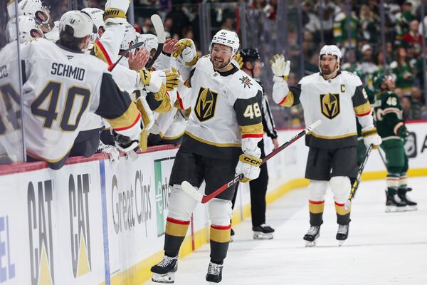 Vegas Golden Knights center Tomas Hertl (48) celebrates with teammates after scoring a goal against the Minnesota Wild during the third period in Game 4 of an NHL hockey Stanley Cup first-round playoff series, Saturday, April 26, 2025, in St. Paul, Minn. (AP Photo/Stacy Bengs)