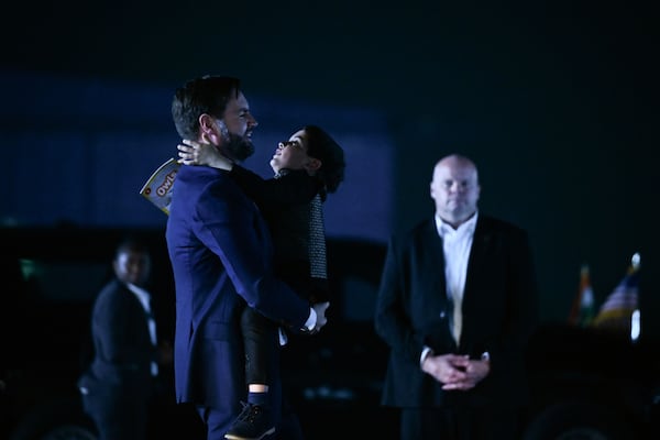 U.S. Vice President JD Vance carries his son Vivek across the tarmac to board Air Force Two en route to Jaipur, India, after spending the day in New Delhi, Monday, April 21, 2025. (Kenny Holston/The New York Times via AP, Pool)