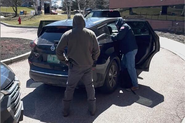 This image taken from a video provided by Christopher Helali shows Mohsen Mahdawi, a Palestinian man who led protests against the war in Gaza as a student at Columbia University, being detained at the U.S. Citizenship and Immigration Services office in Colchester, Vt., on Monday, April 14, 2025. (Christopher Helali via AP)