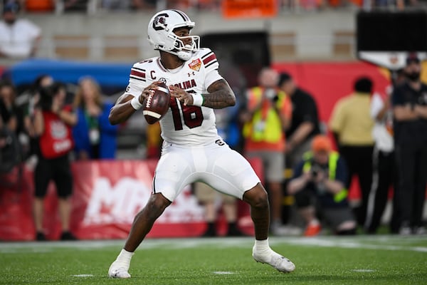 FILE - South Carolina quarterback LaNorris Sellers (16) looks for a receiver against Illinois during the second half of the Citrus Bowl NCAA college football game, Tuesday, Dec. 31, 2024, in Orlando, Fla. (AP Photo/Phelan M. Ebenhack, File)