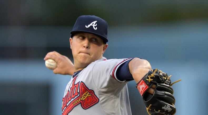 Kris Medlen is returning to the Braves after signing a minor league contract with his original team this week. Once among the most popular Braves, he spent the past two seasons with the Kansas City Royals. (AP file photo)