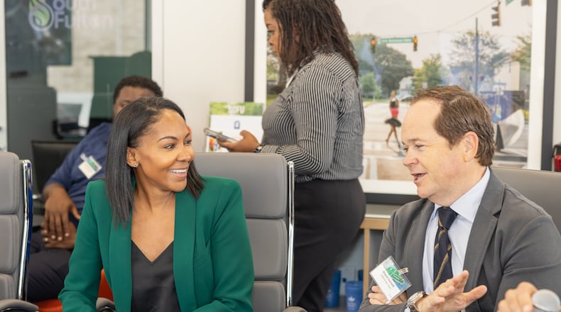 Development Authority of Fulton County Executive Director Sarah-Elizabeth Langford (left) talked to Bryant Cornett, the Atlanta Commercial Board of Realtors education committee chair, on Wednesday, Sept. 27, 2023, during an event to highlight development sites in South Fulton. Image courtesy of The Collaborative Firm.