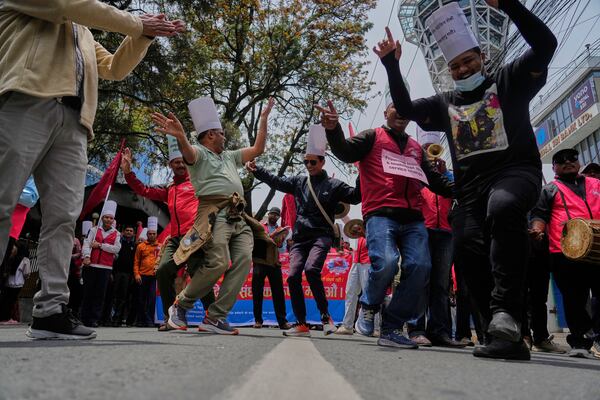 Workers affiliated with Communist Party of Nepal (Maoist Centre) participate in a May Day rally in Kathmandu, Nepal, Thursday, May 1, 2025. (AP Photo/Niranjan Shrestha)