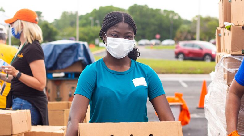 Image of volunteer(s) from Feeding Tampa Bay mobile distribution during the COVID crisis.