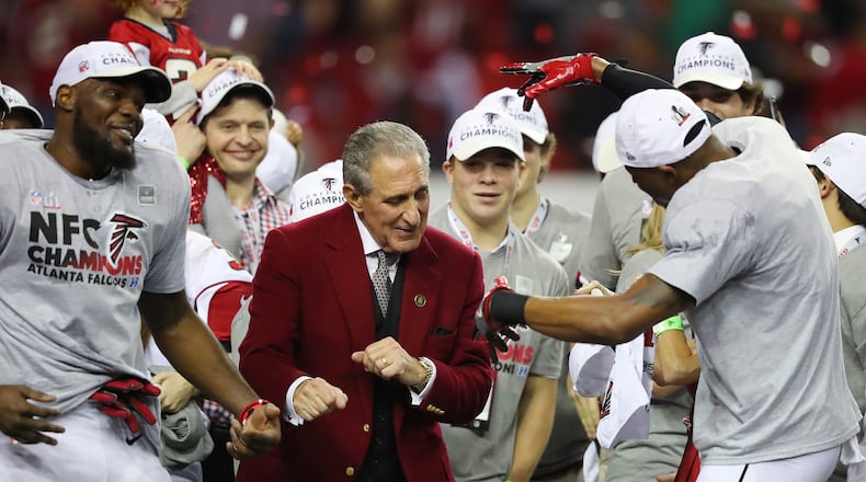 Falcons owner Arthur Blank dances on stage with his players after his team defeated the Green Bay Packers 44-21 in the NFC championship game Sunday at the Georgia Dome. The Falcons will go to the Super Bowl for the first time since the 1998 season. (Curtis Compton/ccompton@ajc.com)