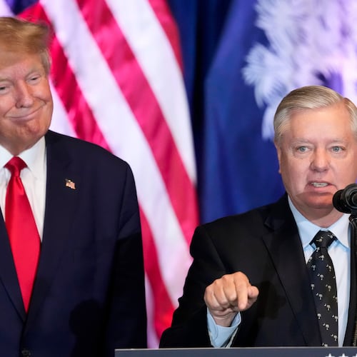 FILE - Former President Donald Trump listens as Sen. Lindsey Graham, R-S.C., speaks at a campaign event at the South Carolina Statehouse, Jan. 28, 2023, in Columbia, S.C. (AP Photo/Alex Brandon, File)