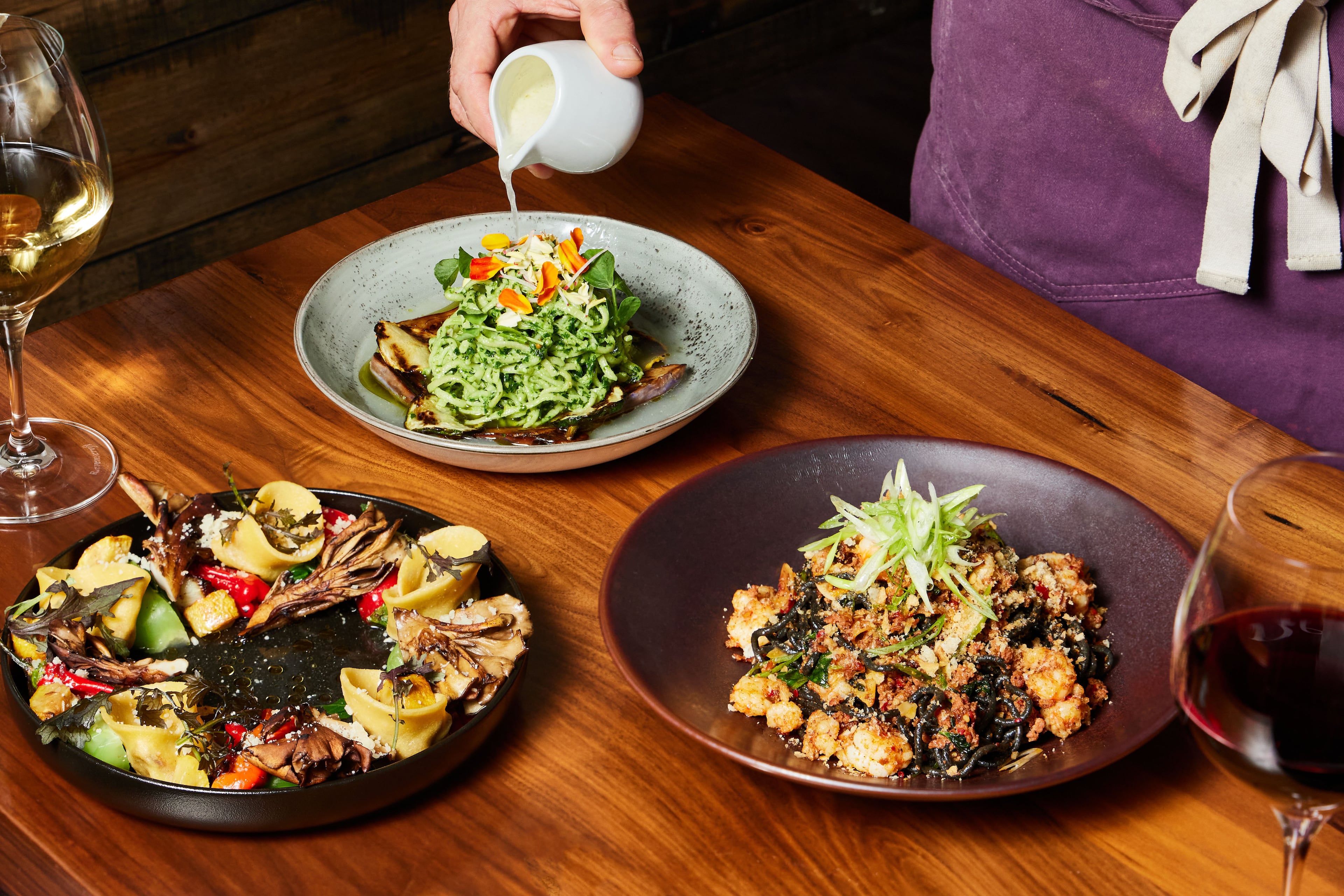 Chef-owner Bruce Logue and his team make magic out of flour, eggs, oil and salt. Pictured (from left): Lamb tortelli in umami brodo; fine linguine with roasted summer vegetables, pesto and Parmesan brodo; and Sorpresine with crab. (Bailey Garrot for the AJC)