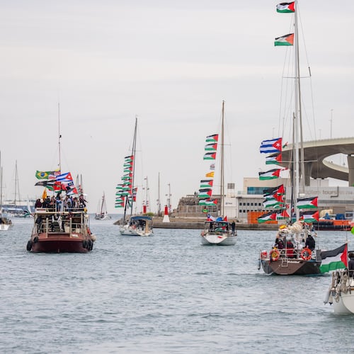 Boats carrying activists and humanitarian aid for Palestinians in Gaza reposition in the port during a symbolic send-off as part of the Global Sumud Flotilla, in Barcelona, Spain, Sunday, April 12, 2026. (AP Photo/Joan Mateu Parra)