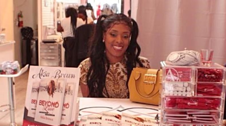 Akia Brown promoting her book "Beyond Love" in Los Angeles. In the book, Brown discusses her nontraditional relationship which resulted in her young children being withdrawn from their Christian school.