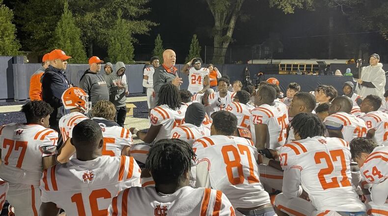 North Cobb head coach Shane Queen addresses him team after the Warriors defeated Marietta 35-9 at Northcutt Stadium to clinch the Region 3-7A championship on Oct. 29, 2021.