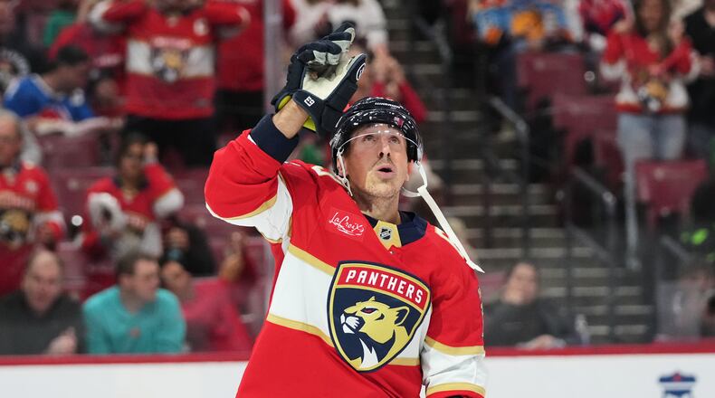 Florida Panthers left wing Brad Marchand celebrates after scoring a goal during the second period of an NHL hockey game against the Dallas Stars, Saturday, Nov. 1, 2025, in Sunrise, Fla. (AP Photo/Lynne Sladky)