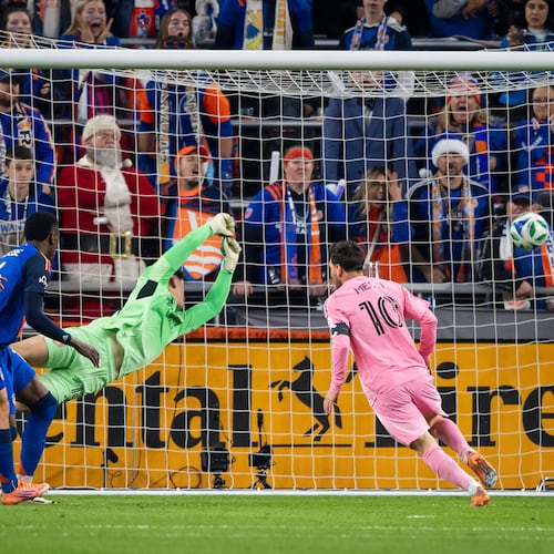 Inter Miami forward Lionel Messi (10) scores as FC Cincinnati goalkeeper Roman Celentano, third from left, tries to defend during the first half of MLS soccer's Eastern Conference semifinal Sunday, Nov. 23, 2025, in Cincinnati. (AP Photo/Tanner Pearson)