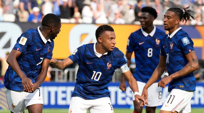 France's Kylian Mbappe, second right, celebrates with his teammates after scoring his side's opening goal during the World Cup round of 32 soccer match between France and Sweden in East Rutherford, N.J., near New York, Tuesday, June 30, 2026. (AP Photo/Seth Wenig)