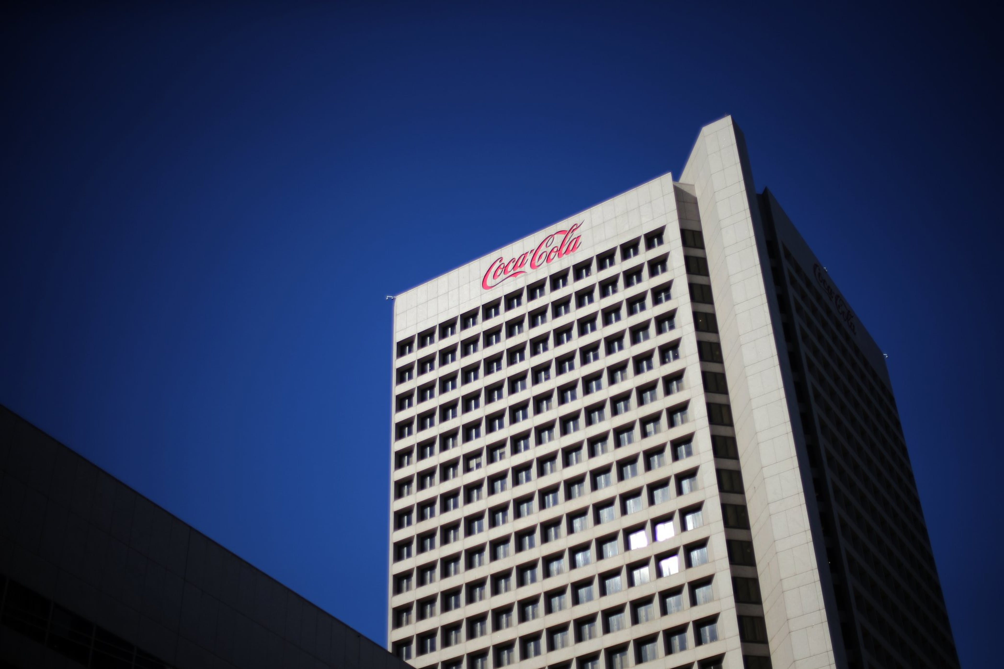 The Atlanta beverage giant also reported third-quarter results Tuesday, beating analyst expectations.