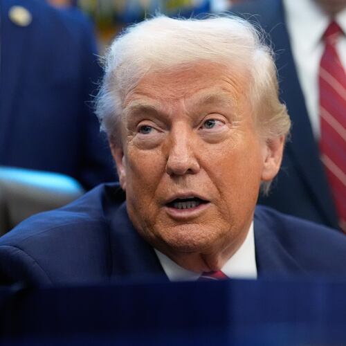 President Donald Trump speaks to reporters after signing a spending bill that ends a partial shutdown of the federal government in the Oval Office of the White House, Tuesday, Feb. 3, 2026, in Washington. (AP Photo/Alex Brandon)