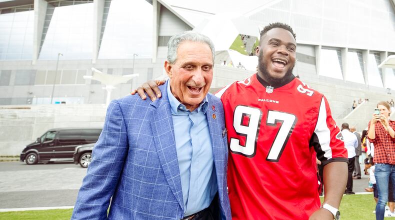 Falcons owner Arthur Blank and Falcons defensive tackle Grady Jarrett celebrated the opening of The Home Depot Backyard, next to Mercedes-Benz Stadium, on Tuesday.