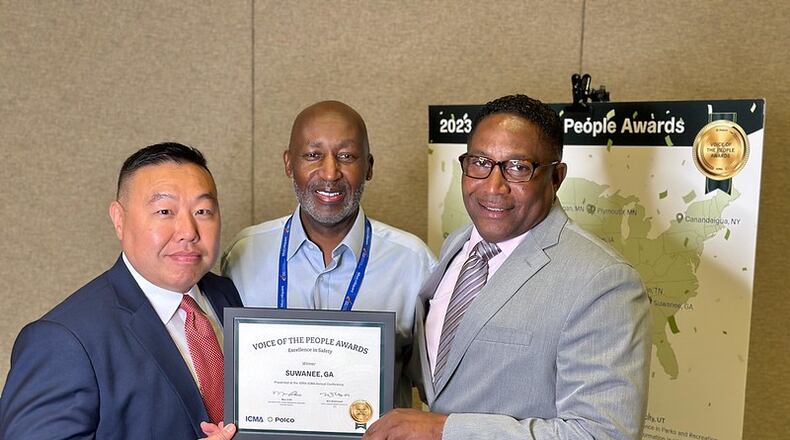 Suwanee Police Captain Dwayne Black and Lt. Simon Byun receive the Voice of the People Award. (Courtesy City of Suwanee)