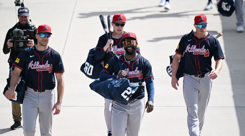 Atlanta Braves outfielder Michael Harris II (center) and teammates walk to the baseball field during the first full-squad spring training workouts at CoolToday Park, Tuesday, February 18, 2025, North Port, Florida. (Hyosub Shin / AJC)