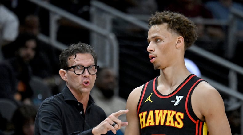 Atlanta Hawks head coach Quin Snyder instructs Atlanta Hawks guard Dyson Daniels (5) during the second half in an NBA basketball game at State Farm Arena, Wednesday, March 12, 2025, in Atlanta. Atlanta Hawks won 123-110 over Charlotte Hornets. (Hyosub Shin / AJC)