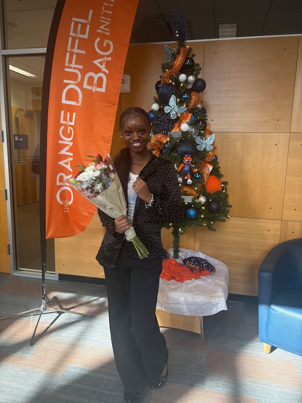 Tytia Arnold celebrates her graduation from the Orange Duffel Bag Initiative after school program. (Courtesy)