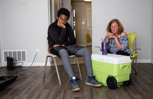  Kendall McGovern and her son pose for photographs in their Forest Park apartment.  STEVE SCHAEFER FOR THE ATLANTA JOURNAL-CONSTITUTION