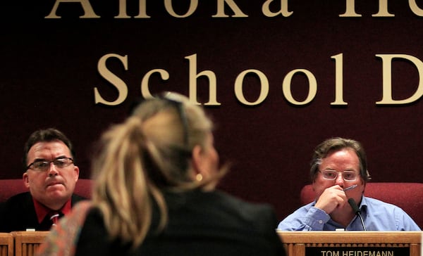 FILE - Vice Chair John Hoffman, left, attends an Anoka-Hennepin School Board meeting in Coon Rapids, Minn., Jan. 9, 2012. (Carlos Gonzalez/The Star Tribune via AP File)