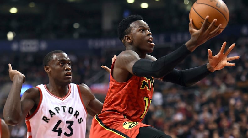 Atlanta Hawks guard Dennis Schroder (17) goes to the basket as Toronto Raptors forward Pascal Siakam (43) defends during the first half of an NBA basketball game Saturday, Dec. 3, 2016, in Toronto. (Frank Gunn/The Canadian Press via AP)