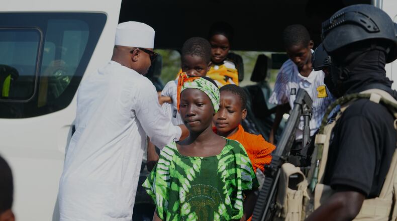 Freed students from St. Mary's Catholic School in the Papiri community arrive at the government house, in Minna, Nigeria, Monday, Dec. 22, 2025. (AP Photo/Sunday Alamba)