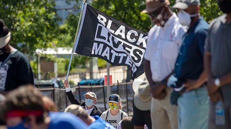 Michael Murphy-McCarthy participates in a rally against racism in Atlanta on Friday. (ALYSSA POINTER / ALYSSA.POINTER@AJC.COM)