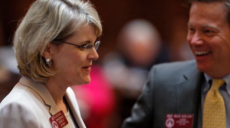 3/29/18 - Atlanta - Rep. Beth Beskin, R - Atlanta, gets congratulated by Rep. Rich Golick, R - Smyrna, after the passage of HB 820, related to  property assessments for Atlanta residents.  Thursday was the 40th and final day of the 2018 General Assembly.    BOB ANDRES  /BANDRES@AJC.COM