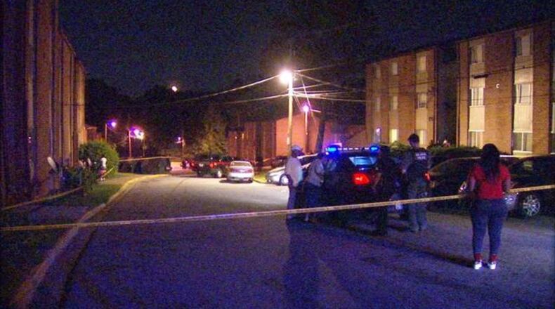 Investigators were at the scene of a shooting at the Fairburn-Gordon Apartments in northwest Atlanta on Thurs., May 26, 2016. (Credit: Channel 2 Action News)