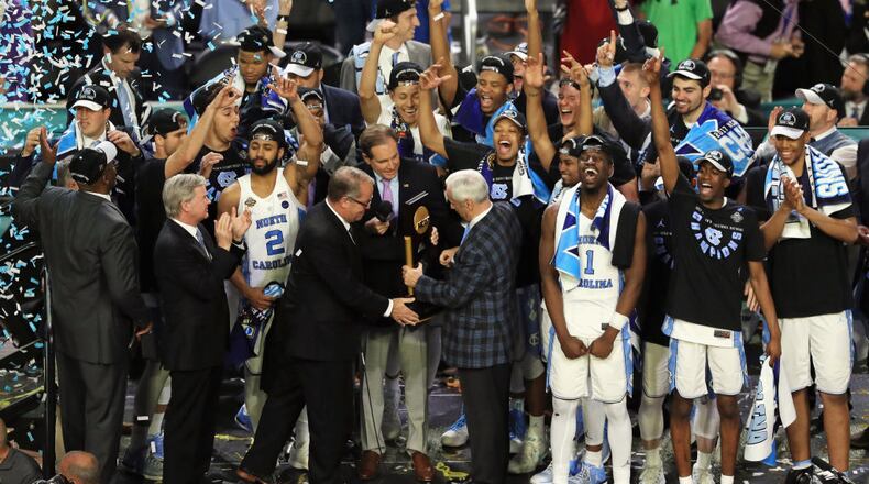 Head coach Roy Williams of the North Carolina Tar Heels receives the Championship trophy after defeating the Gonzaga Bulldogs 71-65 in the 2017 NCAA Men's Final Four National Championship game at University of Phoenix Stadium on April 3, 2017 in Glendale, Arizona.