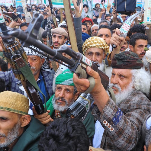 Supporters of Yemen's Houthi rebels raise their rifles during a rally in support of the group and to protest Saudi Arabia's accusation that the Houthis targeted Islam's holiest site of Mecca, in Sanaa, Yemen, Friday, Sept. 18, 2026. (AP Photo/Osamah Abdulrahman)