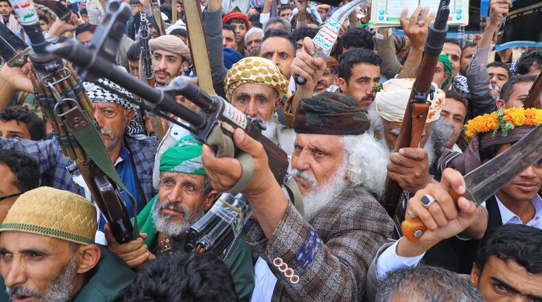 Supporters of Yemen's Houthi rebels raise their rifles during a rally in support of the group and to protest Saudi Arabia's accusation that the Houthis targeted Islam's holiest site of Mecca, in Sanaa, Yemen, Friday, Sept. 18, 2026. (AP Photo/Osamah Abdulrahman)