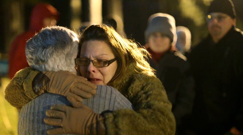 Anita Hunt (facing the camera), a family friend of Travis Clinton Hittson, hugs Travis’ mother, Pat Hittson, just after he was executed Wednesday night, Feb. 17, 2016, at the Georgia Diagnostic and Classification Prison in Jackson. Pat Hittson witnessed her son’s death. (Ben Gray / bgray@ajc.com)