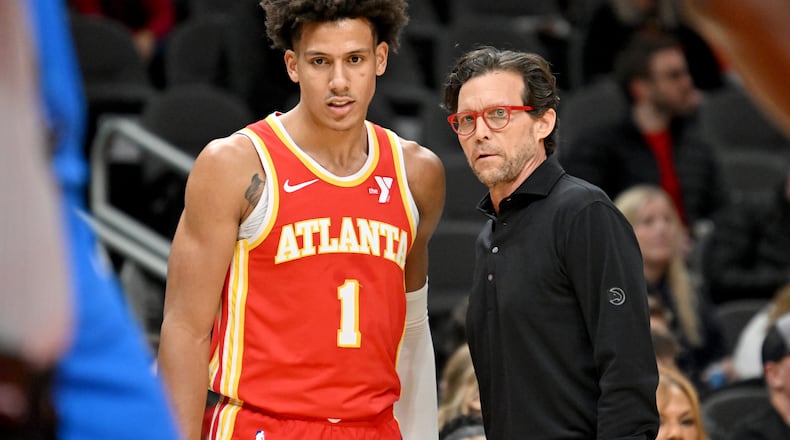 Atlanta Hawks head coach Quin Snyder confers with Atlanta Hawks forward Jalen Johnson (1) during the first half in an NBA basketball game at State Farm Arena, Wednesday, December 3, 2024, in Atlanta. (Hyosub Shin / Hyosub.Shin@ajc.com)